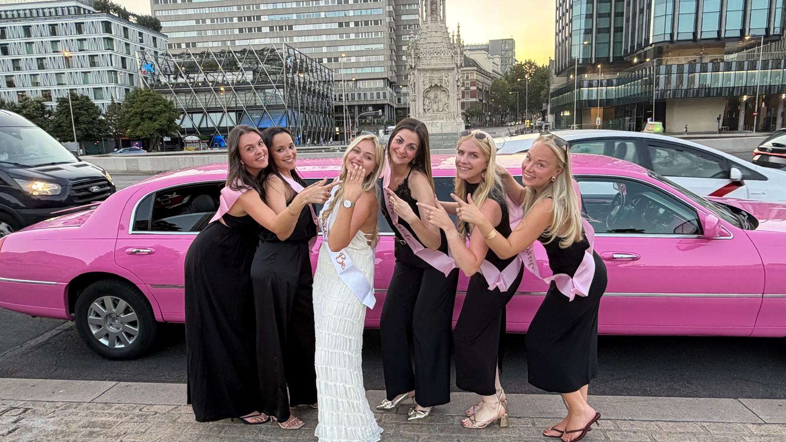 Pink Lincoln limousine in Madrid with bachelorette party